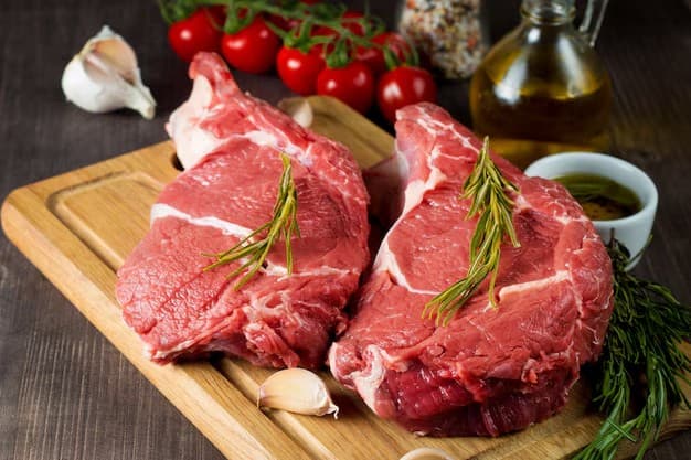Premium fresh meat with rosemary on a professional cutting board